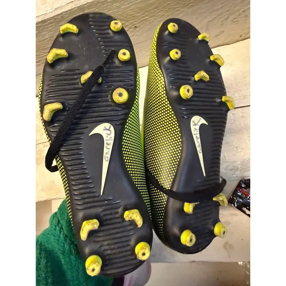Nike black and yellow cleats size 3.5